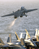An F-14b Tomcat Assigned To The Red Rippers Of Fighter Squadron One One (vf-11) Launches Off The Flight Deck Of Uss George Washington (cvn 73) During Evening Flight Operations. Image
