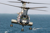 An Ch-46 Sea Knight Helicopter Assigned To Helicopter Combat Support Squadron Eleven (hc 11) Prepares To Pick Up Sling Loaded Cargo From The Fast Combat Support Ship Uss Camden (aoe 2). Image