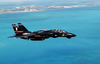 An F-14  Tomcat  Heads Back To Key West Naval Air Station (nas) After Intense  Dog Fight  Training Over The Atlantic Ocean During Exercise Cope Snapper 2002. Image