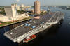 Tug Boats Guide Uss Harry S. Truman (cvn 75) Up The Elizabeth River, Past Portsmouth Landmarks, To The Norfolk Naval Shipyard Image