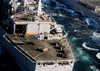 An Mh-60s Sets A Crate On The Deck Of Uss Detroit (aoe 4) Image