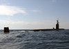 The Los Angeles-class Attack Submarine Uss Toledo (ssn 769) Surfaces To Conduct A Small Boat Transfer Using A Rigid Hull Inflatable Boat (rhib). Image