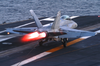An F/a 18 Hornet Lands On The Flight Deck Image