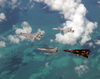 An Air Force F-15  Eagle And F-16  Falcon  Fly In Formation With A Navy F-14  Tomcat  And F/a-18  Hornet  Over The Atlantic Ocean During Exercise Cope Snapper 2002. Image