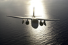 An S-3b Viking Flys Over The Aircraft Carrier Uss Nimitz (cvn 68) Image