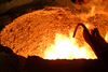 Workers Warm A Ladle Of Steel, Recycled From The World Trade Center, At The Amite Foundry Over A Cauldron Used To Transport Molten Steel To The Mold Of The Bow Stem Of The Amphibious Transport Dock Ship Uss New York (lpd 21) Image