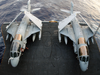 Two Ea-6b Prowlers Are Transported By Aircraft Elevator From The Hangar Bay To The Flight Deck Aboard Uss John C. Stennis (cvn 74) Image