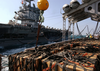 Equipment And Supplies Sit Staged Aboard The Fast Combat Support Ship Uss Detroit (aoe 4), In Preparation For Transfer To The Nuclear Powered Aircraft Carrier Uss Enterprise (cvn 65). Image