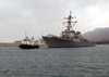 A Tug Boat Leads The U.s. Navy Guided Missile Destroyer Uss Gonzalez (ddg 66) Into Port Image