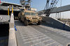 United States Army Vessel (usav) Theater Support Vessel-1x (tsv-1x) Offloads A High Mobility Multipurpose Wheeled Vehicle Image