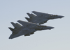 A Pair Of F-14d Tomcats Assigned To The  Bounty Hunters  Of Fighter Squadron Two (vf-2) Conduct A Fly-by Of The Aircraft Carrier Uss Constellation (cv 64). Image