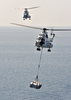 An Sa-330 Puma Helicopter Carries Supplies From Military Sealift Command Ship, Usns Saturn (tafs 10) Over To The Aircraft Carrier Uss Enterprise (cvn 65) During A Replenishment At Sea (ras) Image