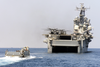 A U.s. Navy Landing Craft Utility (lcu) Approaches The Welldeck Of The Amphibious Assault Ship Uss Nassau (lha 4) Image