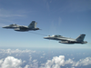 F/a-18f Super Hornets Assigned To The Black Aces Conduct In-flight Refueling Exercises Over Iraq Image