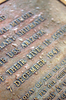 A Commemoration Plaque Is Mounted At The Base Of The Flagstaff Aboard The Uss Arizona Memorial. Image