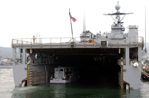 A Small Salvage Craft Carried By The Amphibious Dock Landing Ship Uss Harpers Ferry (lsd 49) Is Launched Into The Sasebo Bay. Stock Photo