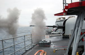 76mm Gun Mount On Navy Frigate Conducts Target Practice. Image