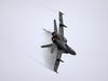 An F/a-18 Hornet Performs A High-speed Turn Near The Aircraft Carrier Uss John C. Stennis (cvn 74) Image