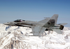 An F/a-18c Hornet Flies Over The Sierra Nevada Mountains During A Routine Training Flight Image