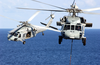 Two Mh-60s Knighthawk Helicopters Assigned To The  Providers  Of Helicopter Composite Squadron Five (hc-5) Pass One Another During A Replenishment Detail With Uss Kitty Hawk (cv 63) Image