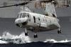 A Ch-46 Sea Knight Carries Supplies And Stores During A Vertical Replenishment (vertrep) Image