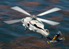 A Sh-60 Seahawk Passes By Naval Air Station North Island During A Routine Training Flight Image