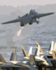 An F-14b Tomcat Assigned To The Red Rippers Of Fighter Squadron One One (vf-11) Launches Off The Flight Deck Of Uss George Washington (cvn 73) During Evening Flight Operations. Clip Art