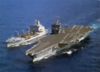 The Uss Enterprise (cvn 65) Steams Alongside The Military Sealift Command Fast Combat Support Ship Usns Leroy Grumman (aoe 195) During An Underway Replenishment (unrep) Clip Art