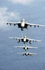 During Flight Operations F/a-18f Super Hornets Fly Over The Western Pacific Ocean In A Tight Formation. Image