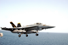 An F/a-18e Super Hornet Configured In The Mission Tanker Role Clears The Flight Deck During Combat Flight Operations Aboard Uss Abraham Lincoln (cvn 72) Image