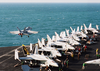 An F/a-18 Super Hornet Assigned To The Eagles Of Strike Fighter Squadron One One Five (vfa-115) Uses His Afterburner During Routine Launch Off Of The Flight Deck. Image