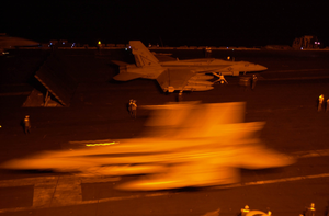 An F/a-18f Super Hornet  Prepares To Take Off From One Of Four Steam-powered Catapults During Night Flight Operations On The Flight Deck Aboard Uss Nimitz (cvn 68). Image