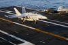 An F/a 18 Hornet Lands On The Flight Deck Image