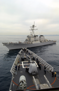 The Guided Missile Destroyer Uss John S. Mccain (ddg 56) Closes In On The Bow Of The Guided Missile Cruiser Uss Vincennes (cg 49), Commencing A Towing Exercise. Image