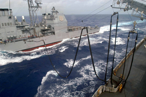 The Guided Missile Cruiser Uss Antietam (cg 54) Prepares To Receive A Fuel Hose From The Fast Combat Support Ship Uss Sacramento (aoe 1) During A Replenishment At Sea (ras) Image