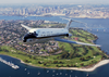 With The San Diego Skyline In The Background, A C-9b Skytrain Ii From The Conquistadors Of Fleet Logistics Squadron Fifty Seven (vr-57) Flies Over Coronado, California Image