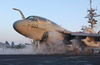 An Ea-6b Prowler Assigned To The Gauntlets Of Electronic Attack Squadron One Three Six (vaq-136) Stands Ready On One Of Two Steam Catapults On The Bow Image