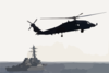 Sh-60f Seahawk Patrols The Waters Astern Of The Guided Missile Destroyer Uss Arleigh Burke (ddg 51) Clip Art