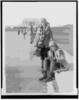 [abbey Jackson, Seated, And Celene Dupuy Ice Skating On Reflecting Pool, With Lincoln Memorial In Background] Clip Art