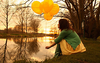 Girl Holding Balloons Image