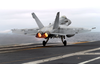 An F/a-18c Hornet Assigned To The Fist Of The Fleet Of Strike Fighter Squadron Two Five (vfa-25) Goes To Full Afterburner As It Performs A Touch-and-go Landing Aboard The Nuclear Powered Aircraft Carrier Uss John C. Stennis (cvn 74). Image