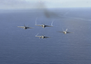 F/a-18e Superhornets Fly In A Diamond Formation Over The Aircraft Carrier Uss Nimitz (cvn 68) Image