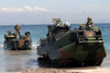 Amphibious Assault Vehicles (aav) Arrive On The Philippine Shore From The Amphibious Transport Dock Ship Uss Fort Mchenry (lsd 43) Image