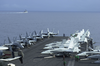 Aircraft From Carrier Air Wing Eleven (cvw-11) Are Chocked And Chained To The Forward Catapults Aboard Uss Nimitz (cvn 68) While The Guided Missile Cruiser Uss Princeton (cg 59) Sails By. Image