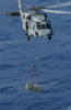 An Mh-60s Knighthawk  Transports Ammunition From The Uss Harry S.truman (cvn 75) To The Military Sealift Command Ammunition Ship Usns Mount Baker (t-ae 34) During An Ammo Off-load Clip Art