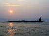 The Ballistic Missile Submarine Uss Rhode Island (ssbn 740) Cruises Through The Atlantic Ocean As Crewmembers Work Up On Deck Image