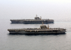 The Aircraft Carriers Uss Constellation (cv 64) And Uss Kitty Hawk (cv 63) Steam Alongside One Another. Image