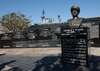 Against The Backdrop Of The Battle Of Letye Gulf Memorial In Downtown San Diego, The Decommissioned Aircraft Carrier Midway Is Moved Into Her Final Berth At The Old Naval Supply Pier Image