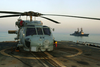 An Sh-60  Sea Hawk  Helicopter Rests On The Fantail Of The Mobile Bay Image