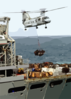 A Ch-46 Sea Knight Helicopter Delivers Supplies From The Fast Combat Support Ship Uss Bridge (aoe 10) To The Aircraft Carrier Uss Constellation (cv 64) During An Underway Replenishment Clip Art